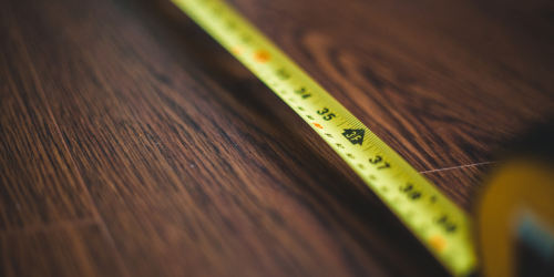 yellow measuring tape stretched on the floor