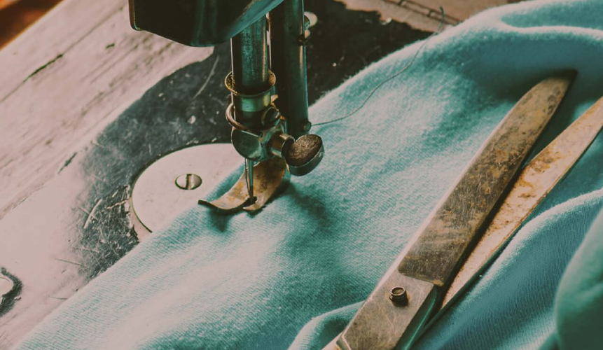 hand-stitching-a-mattress the outer layer of a mattress being sewn together