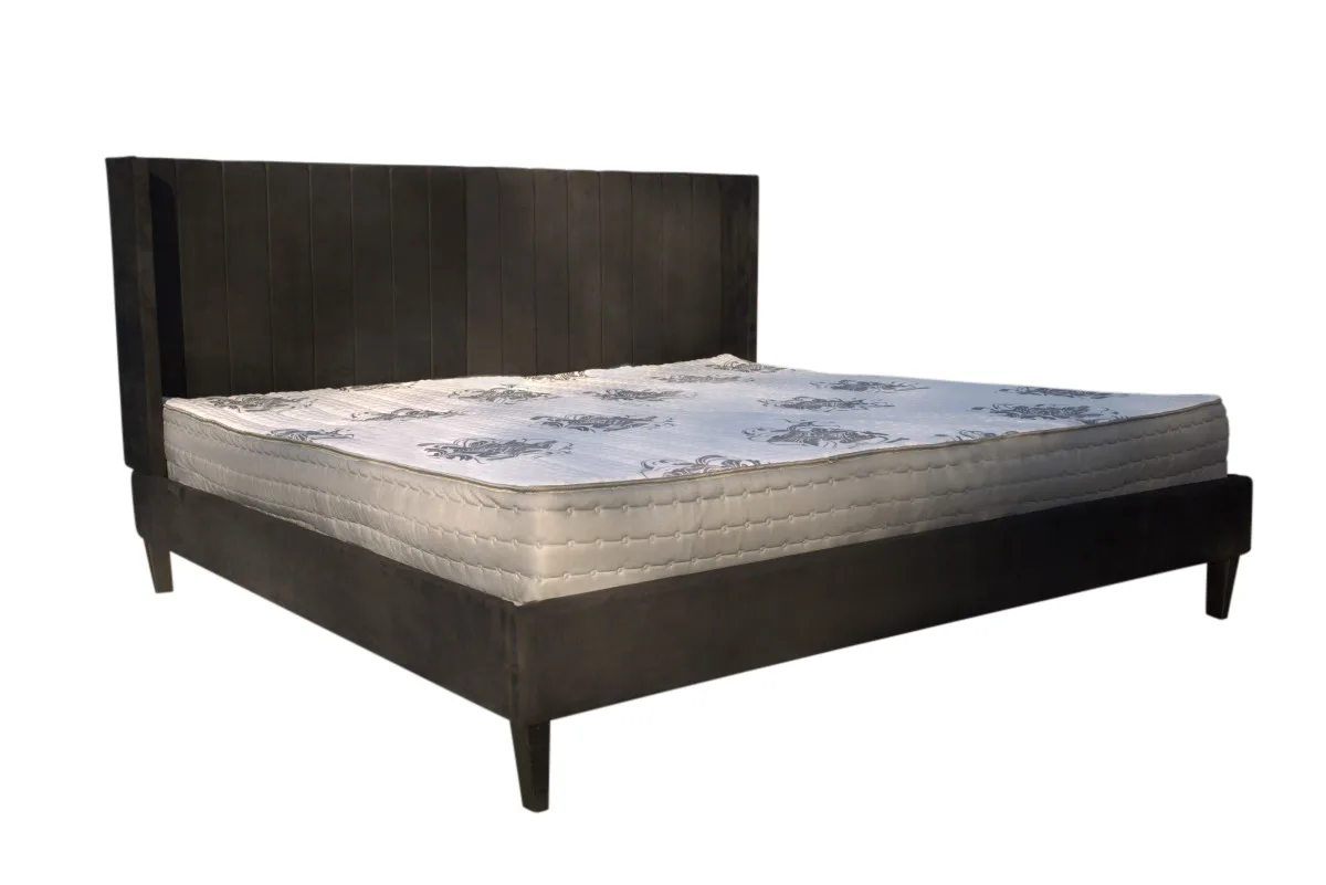 an Alaskan king mattress on a bed frame made to match it