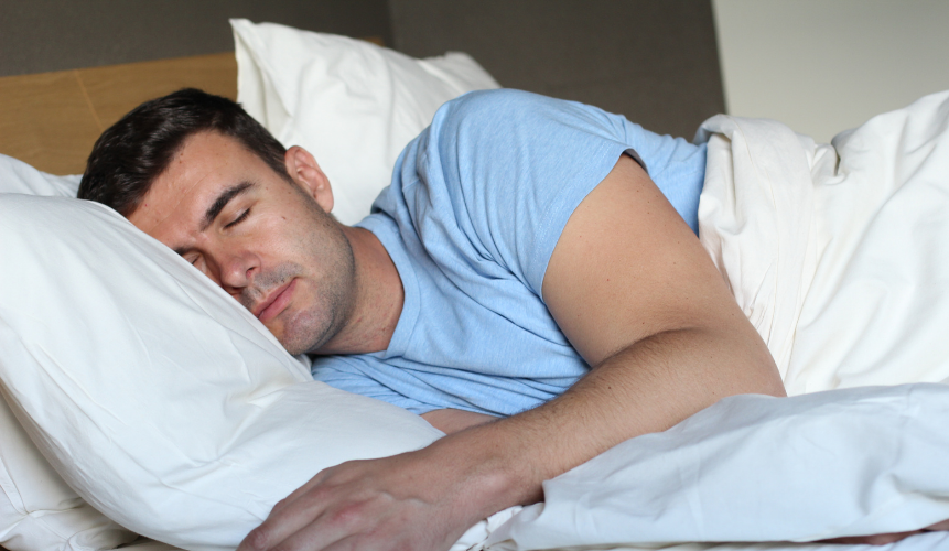 Man asleep on the perfect oversized mattress from Delarkin.